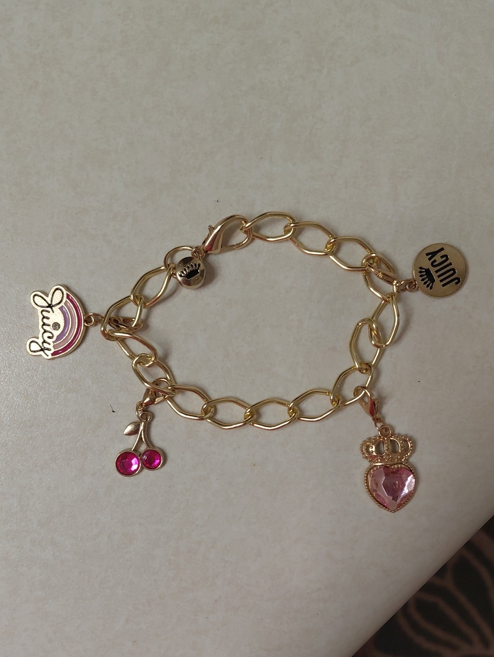 Juicy Couture Gold-Tone Bracelet with Pink Charms